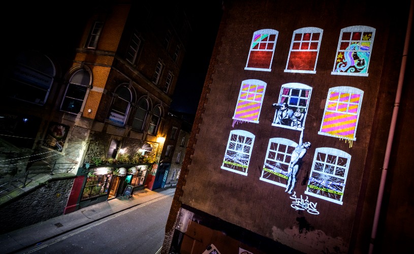 Neighbours artwork for Bristol Light Festival featuring Banksy's Well Hung Lover